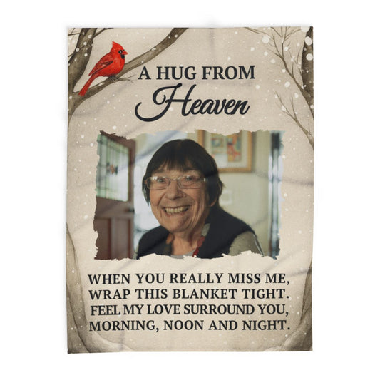 Memorial photo with text 'A Hug from Heaven' and a red cardinal on a beige background.