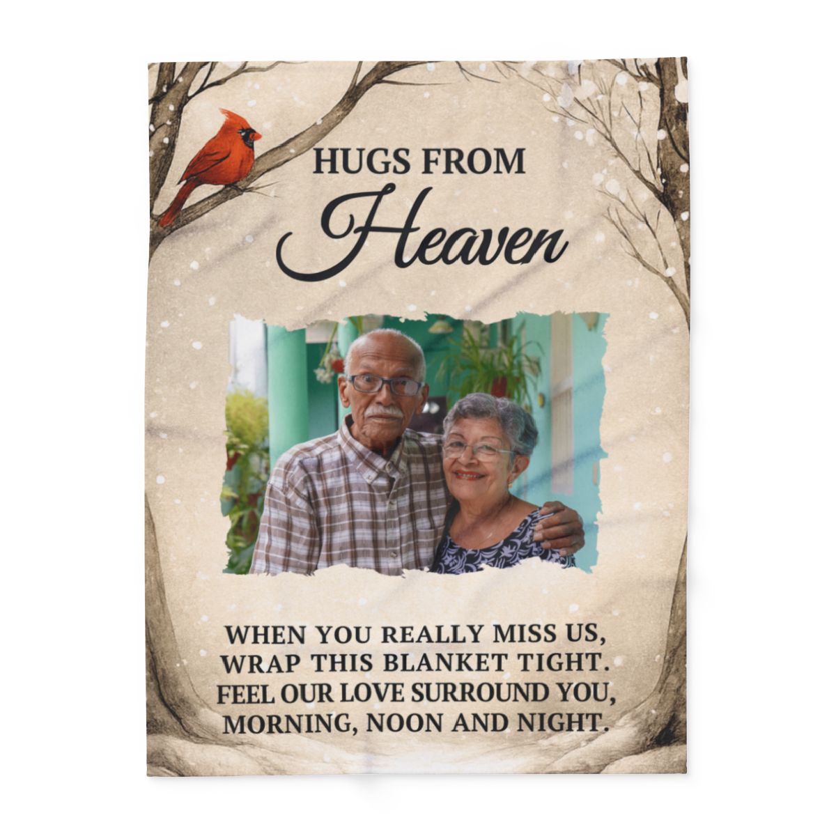 Blanket with an image of an elderly couple and text 'Hugs from Heaven' on a beige background.