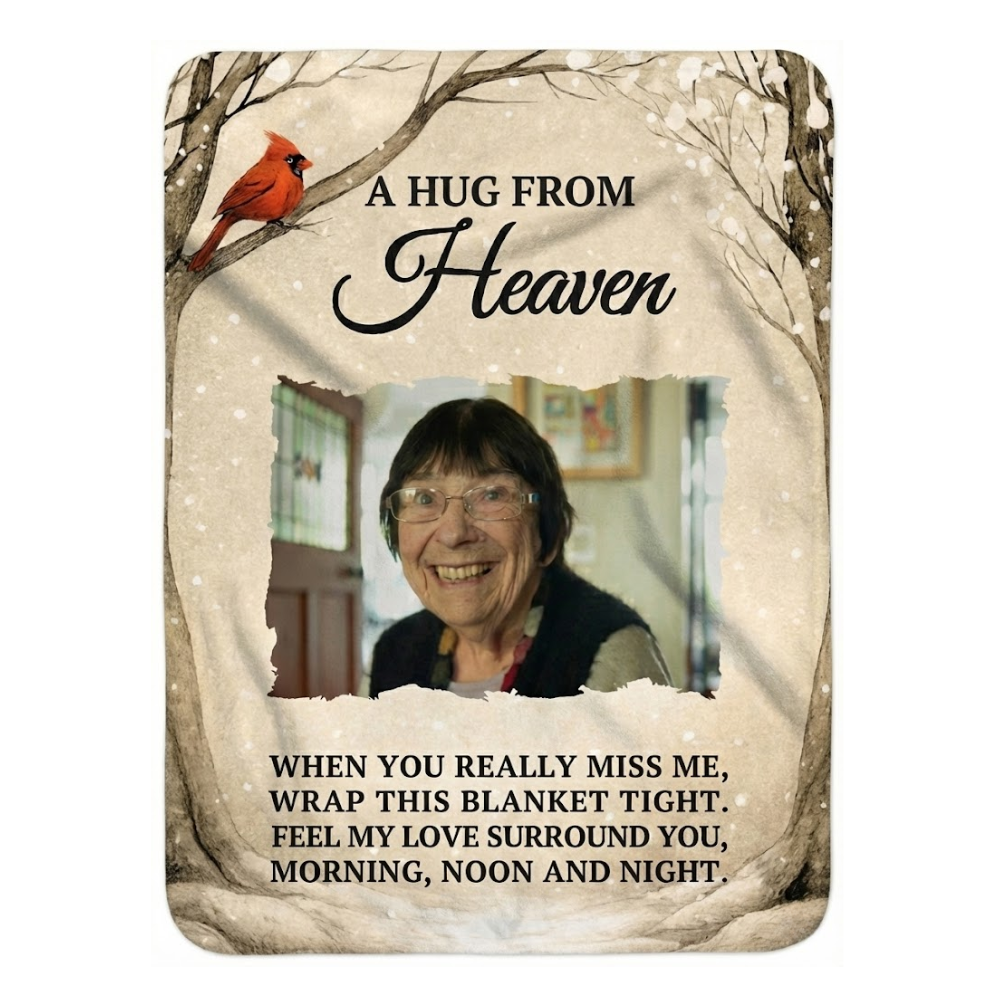 Blanket with a photo of a smiling woman and text 'A Hug from Heaven' on a white background